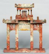 A Chinese hardstone architectural model
With pierced and incised decoration, standing on a plinth