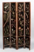 A 19th century Oriental four fold lacquered screen
Each panel inset with hardstone birds amongst