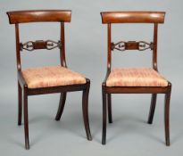 A set of six Regency mahogany dining chairs
The curved top rail supported by twin uprights centred