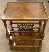 A Victorian burr walnut Canterbury whatnot
The line inlaid rounded rectangular top set with a