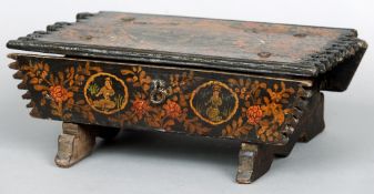 A 19th century Kashmiri painted stool 
With allover floral decoration and figural vignettes.  37 cms