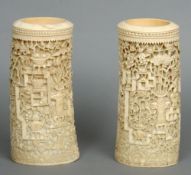 A pair of 19th century Cantonese carved ivory tusk vases
Each decorated in the round with various