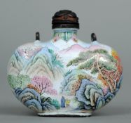 A Cantonese enamel snuff bottle
Decorated with figures amongst mountainous landscape, the