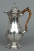 A Victorian silver coffee pot, hallmarked London 1886, maker's mark of Charles Stuart Harries
Of