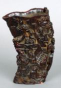 A Chinese horn libation cup
Decorated with figures amongst a landscape, the underside with carved