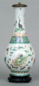 A 19th century Chinese famille verte porcelain bottle vase, (converted to a lamp)
The neck painted