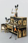 A set of early Marx Merrymakers clockwork tin toys
Comprising: pianist and conductor, a drummer