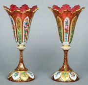 A pair of 19th century Bohemian cranberry glass overlay vases
Each of flared castellated form with