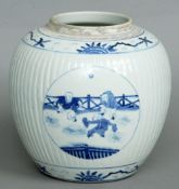 A 19th century Chinese blue and white ginger jar
The ribbed body decorated with vignettes of playing