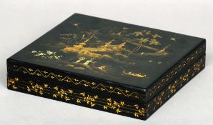 A 19th century chinoiserie lacquered papier mache box
The removable rectangular lid decorated with