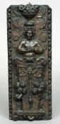 A 16th century carved oak panel
Carved with a female bust beneath a flowering urn before scrollwork.