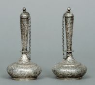 A pair of 19th century Persian unmarked white metal bottle flasks
Each finial mounted lid attached