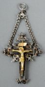 A 19th century unmarked white metal and gilt white metal crucifix form pendant
Formed with a