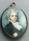 A 19th century portrait miniature of a young gentleman
Wearing a green tunic, painted on ivory,