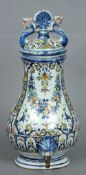 A 19th century French polychrome decorated cistern
The removable lid flanked by dolphins, above