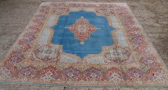 A Kirman wool carpet
The sky blue field with central medallion within arabesque spandrels and