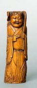 A 19th century Chinese carved stained ivory figure
Formed as a woman holding a lotus flower, the