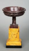 A 19th century Italian Grand Tour porphyry urn
The circular bowl above the slender stem and plinth