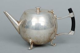 A Christopher Dresser style silver plated teapot
The main body of bullet form.  19 cms wide.