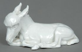 ERIC OEHME, a porcelain white ware model of a donkey
Naturalistically modelled laying down, the