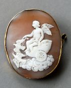 A 19th century unmarked yellow metal framed cameo brooch
The front carved with a cherub in a chariot