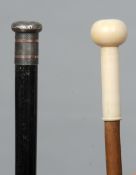 A Victorian ivory handled walking stick
The knop mounted handle above the plain shaft; together with