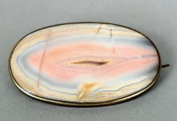 A 19th century unmarked silver mounted agate brooch
Of domed oval form, the reverse with