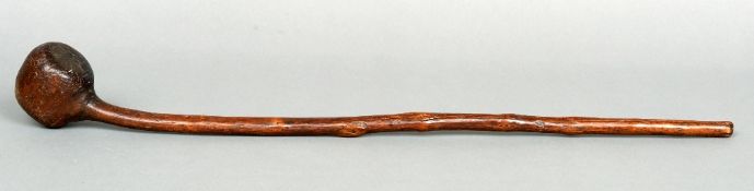 An African carved hardwood tribal knobkerrie, possibly from the Basuto tribe
76 cms long.