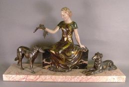 A French Art Deco bronzed spelter figural group
The central female figure holding a garland of