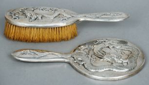 An early 20th century Chinese silver dressing table brush and hand mirror, maker's mark of PC
Each