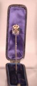 A Victorian diamond set yellow metal and enamelled stick pin
Modelled as a Royal cypher, in fitted