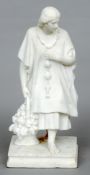 A 19th century white marble figurine, "The Fruit Carrier"
Modelled holding a basket of fruit,