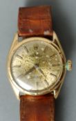 An 18 ct gold Rolex oyster perpetual wristwatch
The circular dial with batons.  3.5 cms wide.