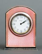 An early 20th century Sterling silver and enamel desk clock
With pink guilloche enamel decoration,