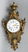 A large 19th century bronze Cartel clock
The urn form finial above the white enamelled dial with