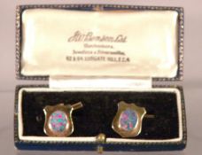 A pair of 9 ct gold opal set cufflinks
In fitted case for Benson Limited, London.   CONDITION