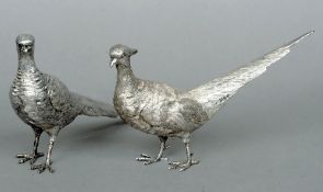 A pair of silver models of pheasants, each hallmarked London 1976, maker's mark of CS
The cock