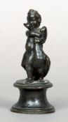 A 19th century bronze figural group
Formed as a putto and a swan, standing on a waisted