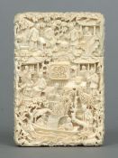 A 19th century Cantonese card case
Carved in the round with figures and pagodas in a landscape,