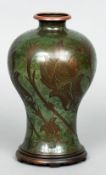 A WMF Arts & Crafts copper vase
The green enamel ground decorated with stylised flowers, standing on