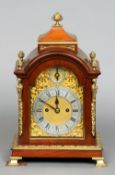 A 19th century gilt bronze mounted mahogany mantel clock
The finial mounted domed top above the