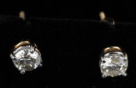 A pair of 15 ct gold diamond ear studs
Each approximately 4mm diameter.   CONDITION REPORTS: