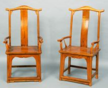A pair of Chinese elm open armchairs
Each serpentine top rail above a curved back splat and twin
