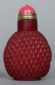 A 19th century Peking ruby red glass snuff bottle
With a hardstone and gilt metal stopper, the