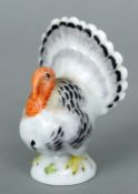 A small Meissen model of a turkey
Naturalistically modelled, standing on a domed base, the underside