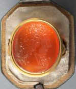A 19th century unmarked gold intaglio ring
The oval carnelian carved with a bust and inscribed