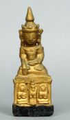 A 19th century carved giltwood model of a deity
The crowned figure formed seated in the lotus