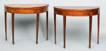 A near pair of George III mahogany demi-lune card tables
Each hinged top enclosing a baize lined