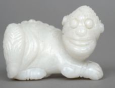 A carved mutton fat jade model of a dog-of-fo
Typically modelled.   5.5 cms long.   CONDITION