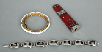 An Art Deco amber and silver cigarette holder, a Miriam Haskell bracelet and a silver Art Deco